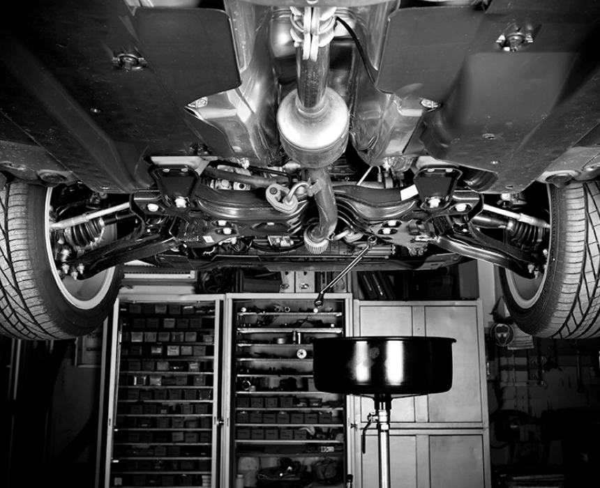 A black and white photo of an industrial kitchen.