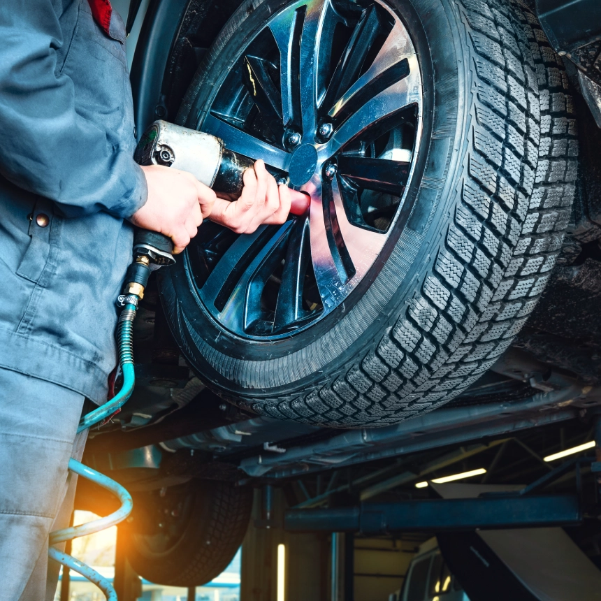 A person is working on a tire.